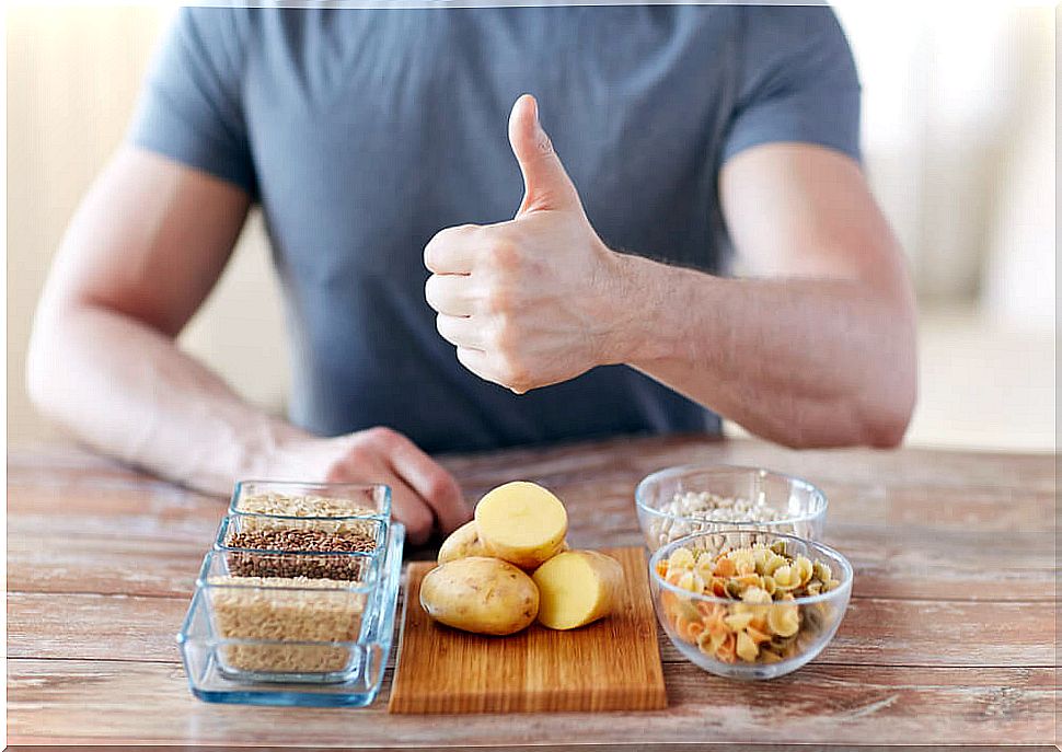 Man with food raising finger