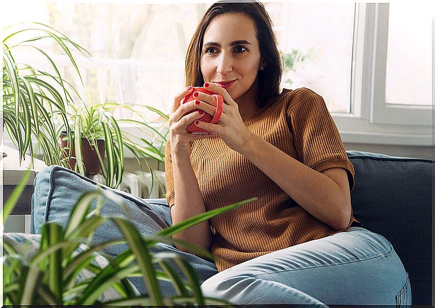 Relaxed woman drinking coffee