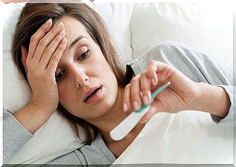 Woman in bed with fever